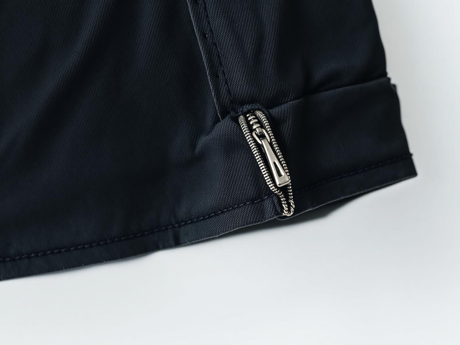 Detail — washed twill, concealed zip terminal